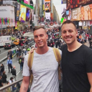 Brandon and Tyler smiling in Times Square.