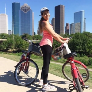 Claudia with a bicycle.