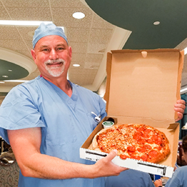 Aya Healthcare - RN Jeffrey With Pizza
