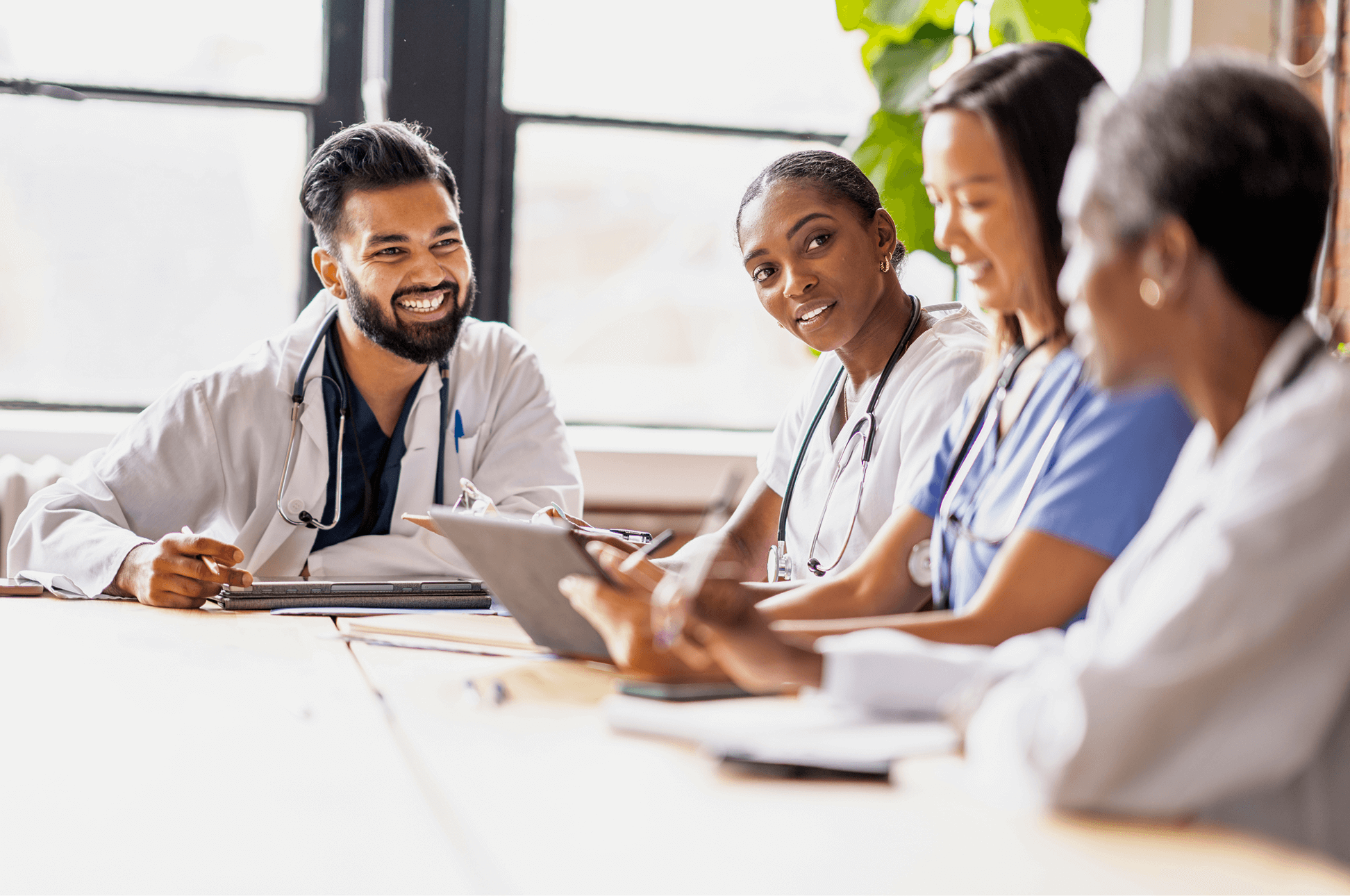 Nurse holding phone towards scanner