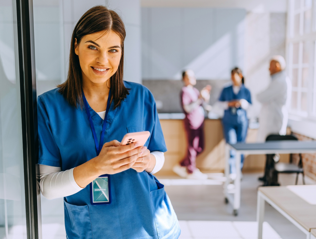 Nurse holding phone towards scanner